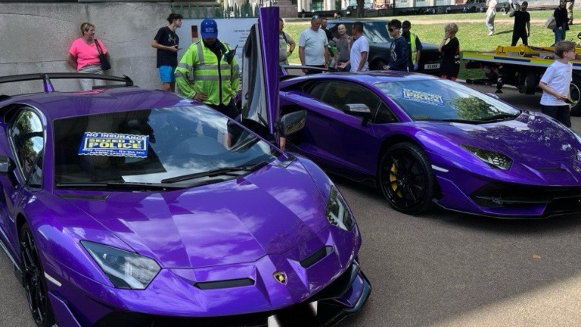 Two purple Lamborghinis seized by the police for no insurance.